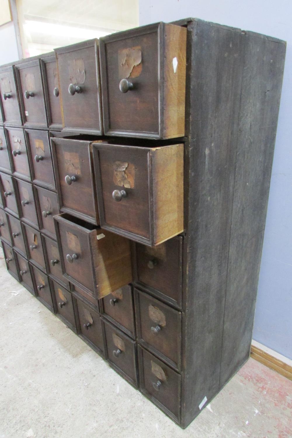 A very large 19th century oak run of 35 drawers, oak lined, each drawer 30 cm height x 27 cm wide - Image 5 of 5