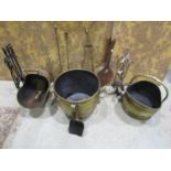 A brass log bin on lions paw feet with loop handles, coal scuttle, elm bellows, sundry fire irons,