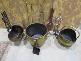 A brass log bin on lions paw feet with loop handles, coal scuttle, elm bellows, sundry fire irons,