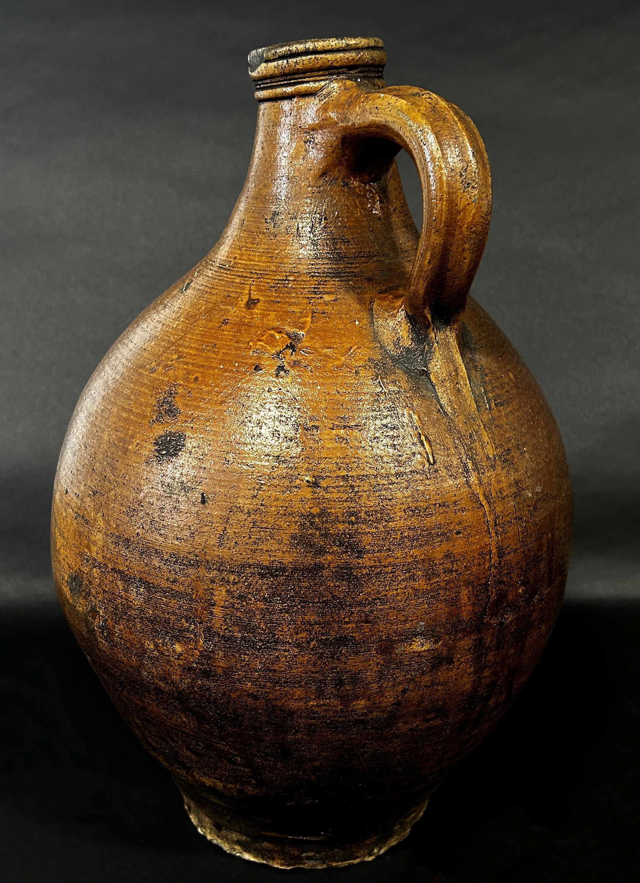 A stoneware Bellarmine with moulded face and symbol, 37cm high - Image 3 of 4