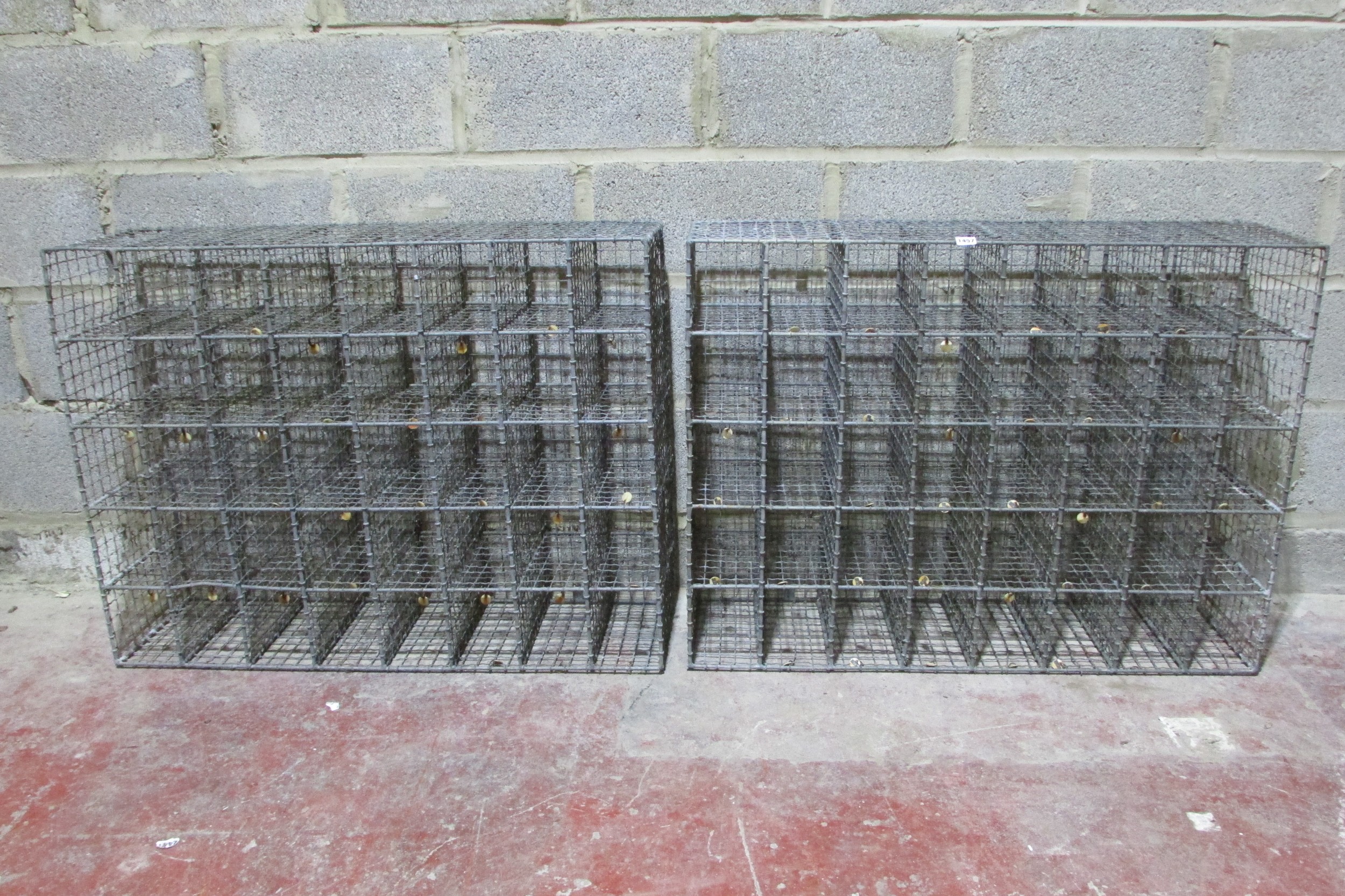 A pair of heavy gauge vintage galvanised wirework shoe racks, each to hold 20 pairs, 77cm high x