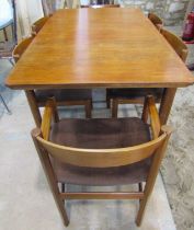 A mid-century MacIntosh teakwood extending dining table and six matching dining chairs