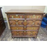 An early 18th century oak chest of three long and two short drawers with geometric block moulded