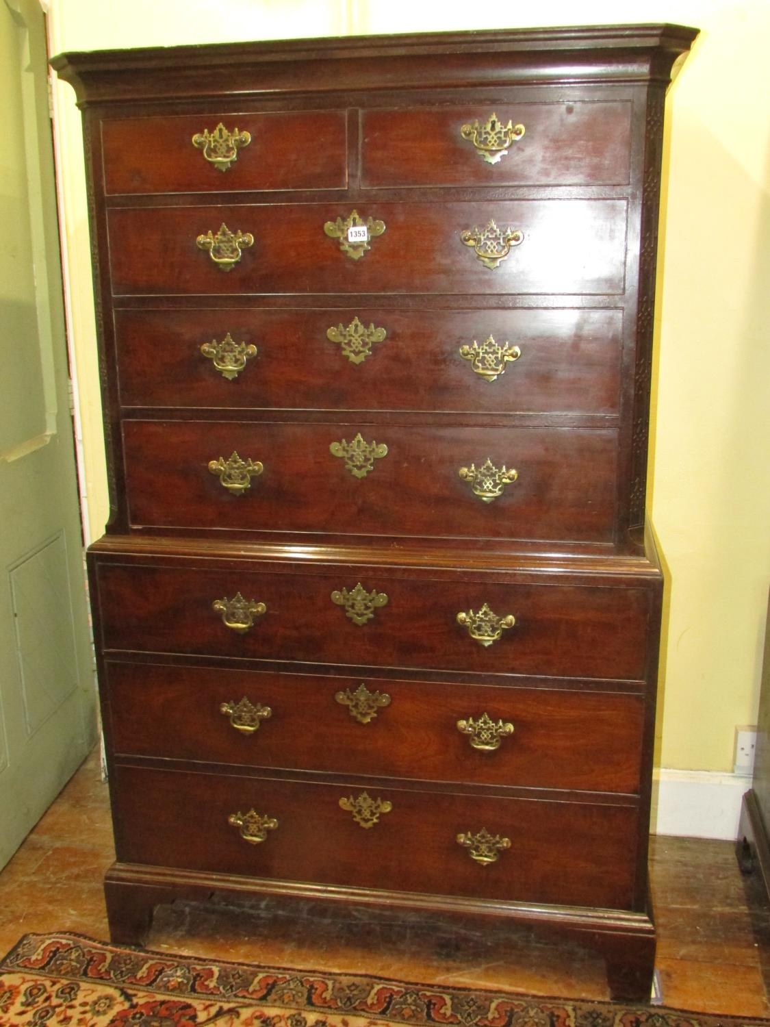 A George III mahogany chest on chest of diminutive proportions, the upper section with blind fret