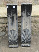 A pair of Regency black marble scrolling bosses, with acanthus detail, 60cm high