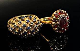 Two 1970s 9ct dress rings; a garnet oval cluster ring, maker 'G&T.J', London 1977, size N/O, 3.7g