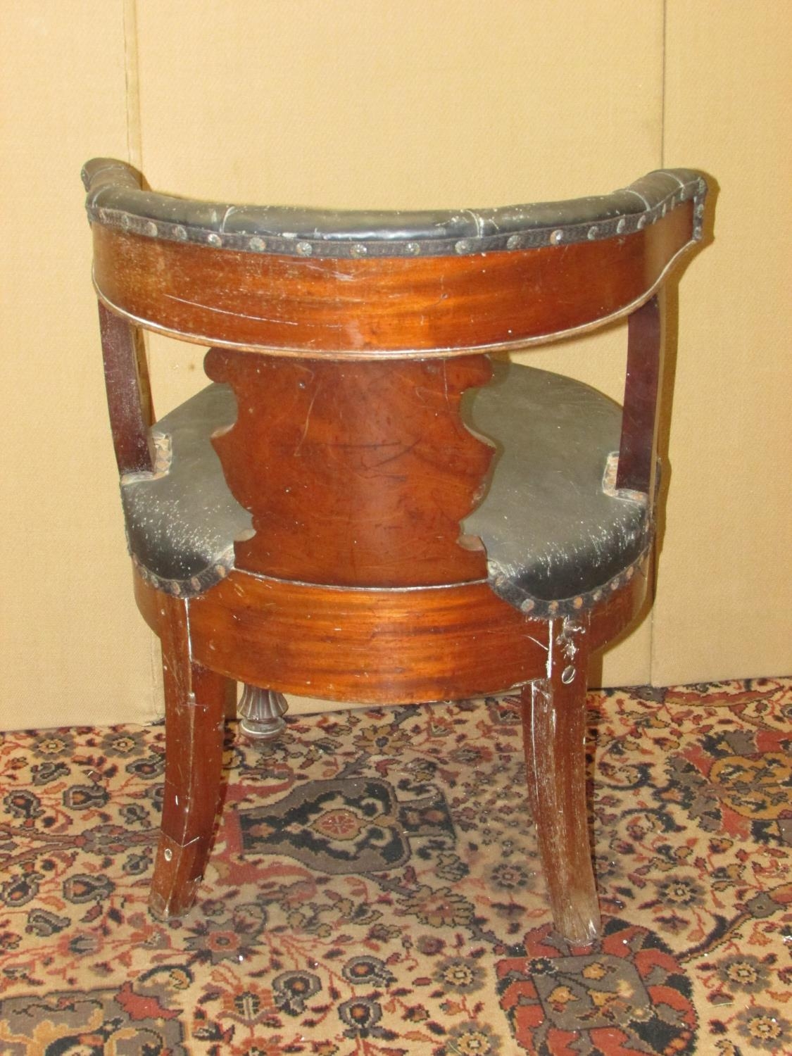 A 19th century mahogany library chair with carved splat, horseshoe shaped back and circular seat - Image 4 of 4