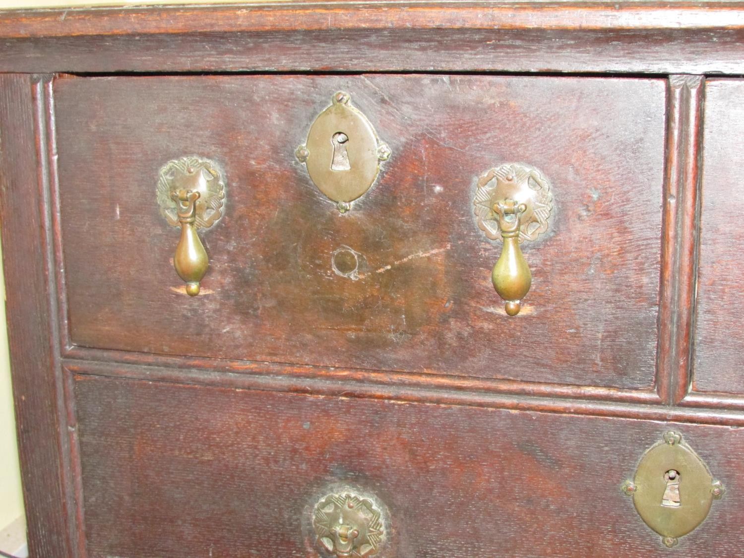 A small 18th century oak chest of two long and two drawers raised on bracket supports with pear drop - Image 4 of 4