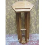 An unusual lectern in oak, the hexagonal top raised on six shaped supports