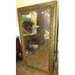 A 19th century wall mirror of rectangular form within a preannounced moulded border, 144cm x 81cm