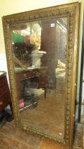 A 19th century wall mirror of rectangular form within a preannounced moulded border, 144cm x 81cm