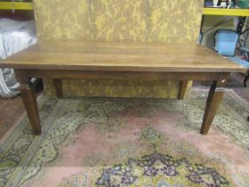 An Old English style oak farmhouse table, the plank top with moulded borders, raised on four