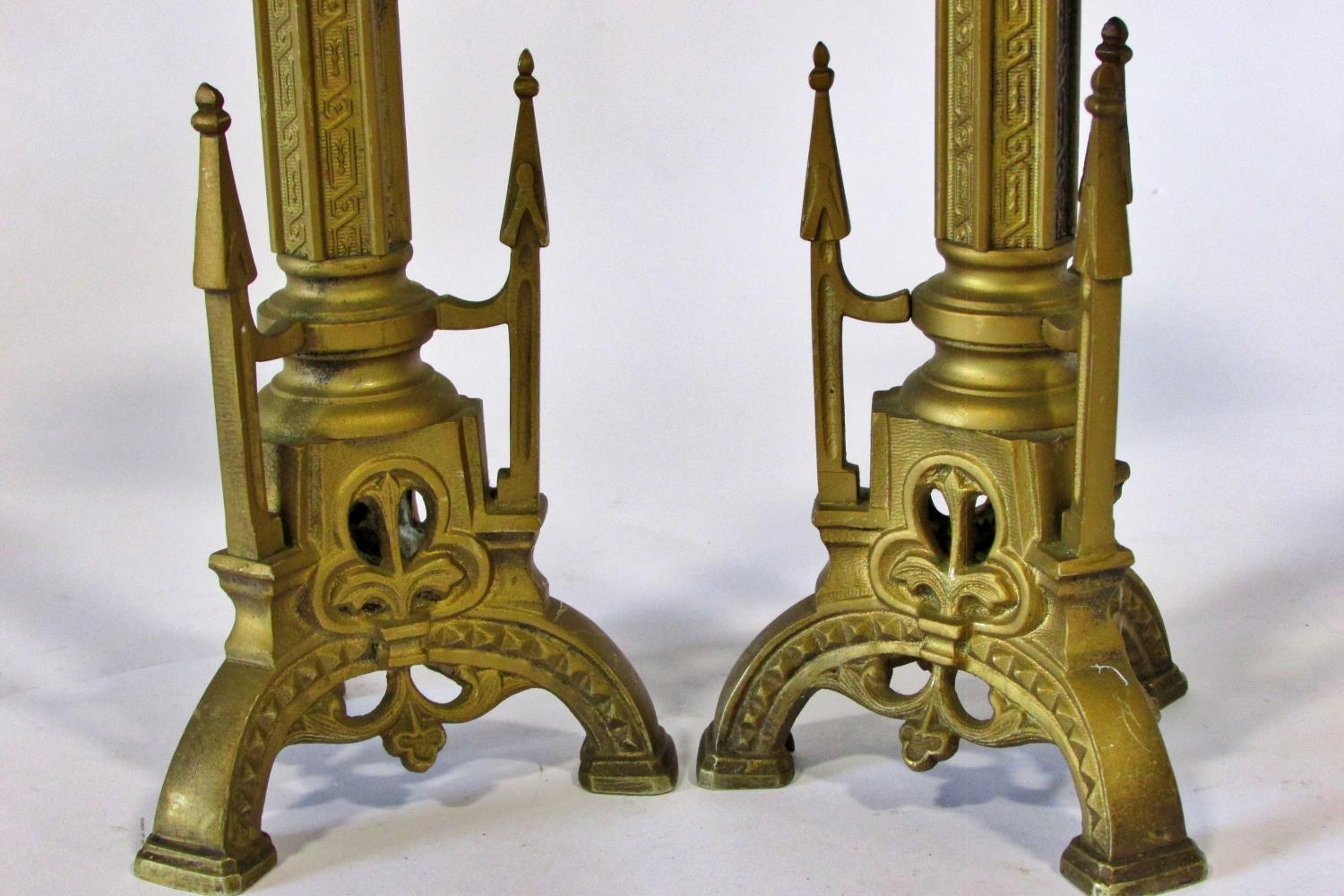 A small pair of late 19th / early 20th century continental cast metal Puginesque candlesticks,