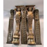 A substantial pair of 19th century carved walnut figural brackets / adornments, in the form of