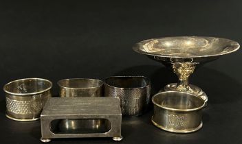A mixed selection of silver ware including a blue glass lined sugar bowl, a scalloped dish, a