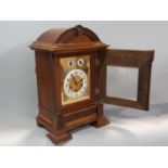 A walnut cased bracket / mantle clock, with silvered chapter ring populated with black Arabic