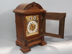 A walnut cased bracket / mantle clock, with silvered chapter ring populated with black Arabic