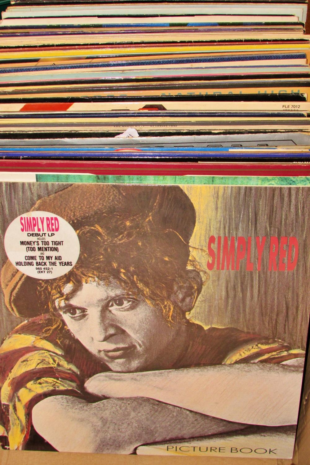 A collection of LP records (60+) to include Simply Red, U2, The Beatles, UB40 & many others,