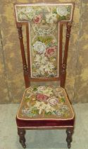 A good Victorian upholstered priedu with floral tapestry upholstered seat and T shaped back within a