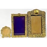 Three silver gilt easel frames with Rococo scrolled decoration, the two rectangular Birmingham,