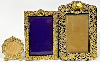 Three silver gilt easel frames with Rococo scrolled decoration, the two rectangular Birmingham,