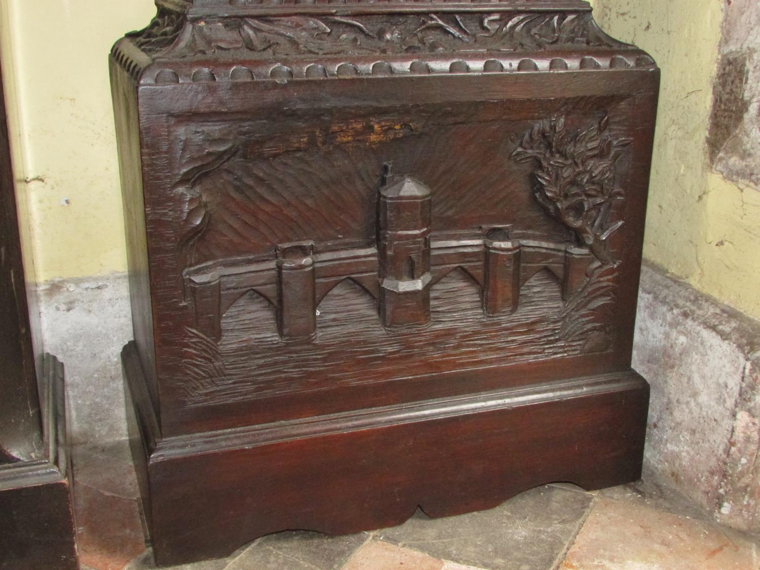 A 19th century oak longcase clock with heavy estate carving, the trunk detailing a knight fighting - Image 13 of 17