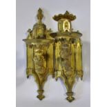 A good pair of 19th century Puginesque gilt brass single light wall sconces, with pierced branches