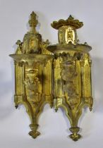 A good pair of 19th century Puginesque gilt brass single light wall sconces, with pierced branches