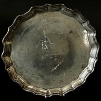A Birks sterling silver salver with a scrolled edge, bearing a dedication, 30cm diameter, 26oz
