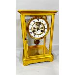 A 19th century French gilt brass cased four pane mantle clock, with enamelled chapter ring, 27cm