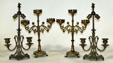 Two pairs of 19th century ecclesiastical brass candlesticks to include a three-light pair with