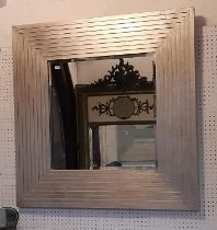 A heavy stepped contemporary wall mirror in the art deco style, 90cm square