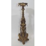 A large and impressive 19th century ecclesiastical gilt brass pricket candle stick, with arched