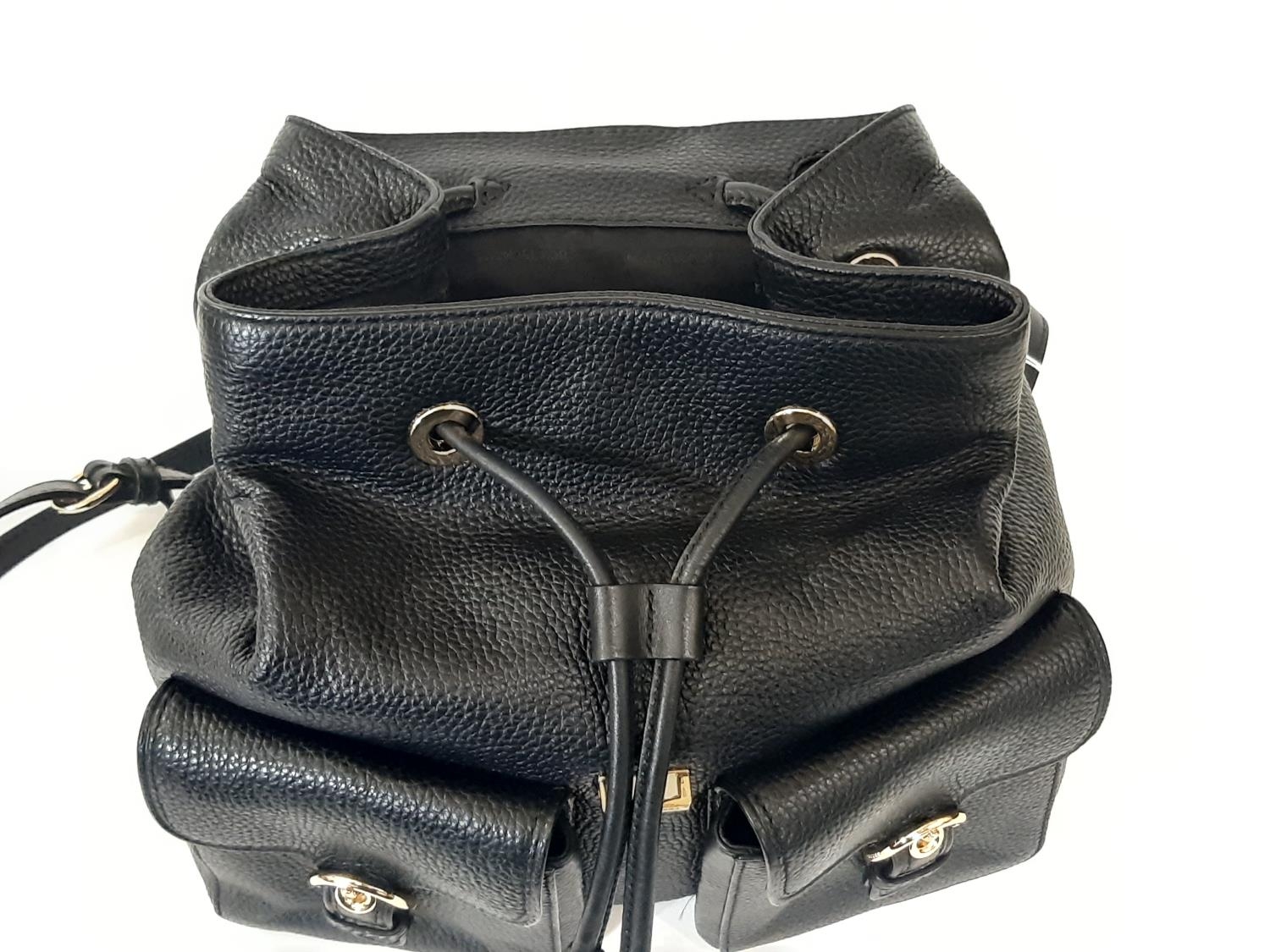 Ladies backpack style bag by Michael Kors in textured black leather with top flap, 2 front pockets - Image 3 of 3