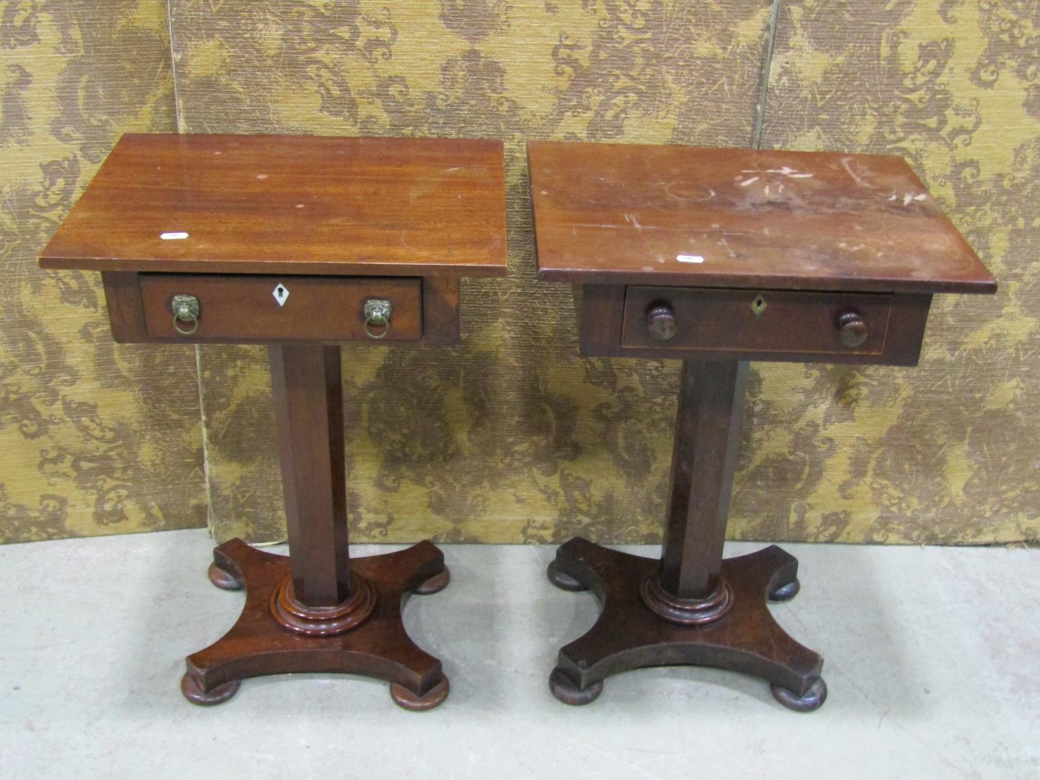 Two similar pedestal tables, each enclosing a single drawer on platform bases
