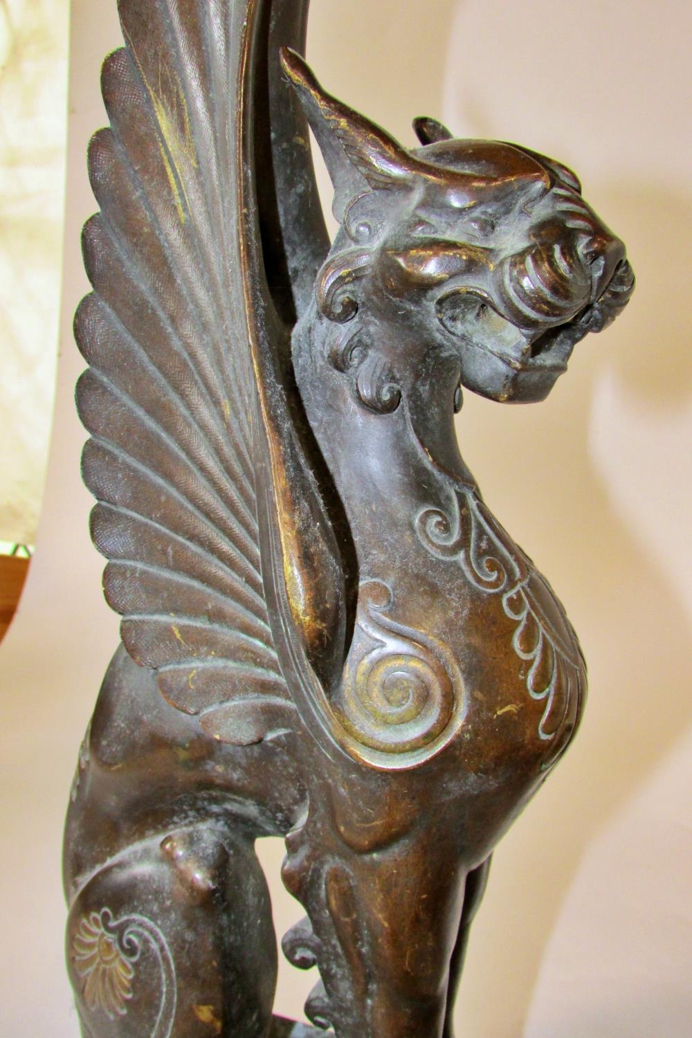 A substantial pair of 19th century cast bronze gryphons, seated in profile, raised on stepped - Image 4 of 6