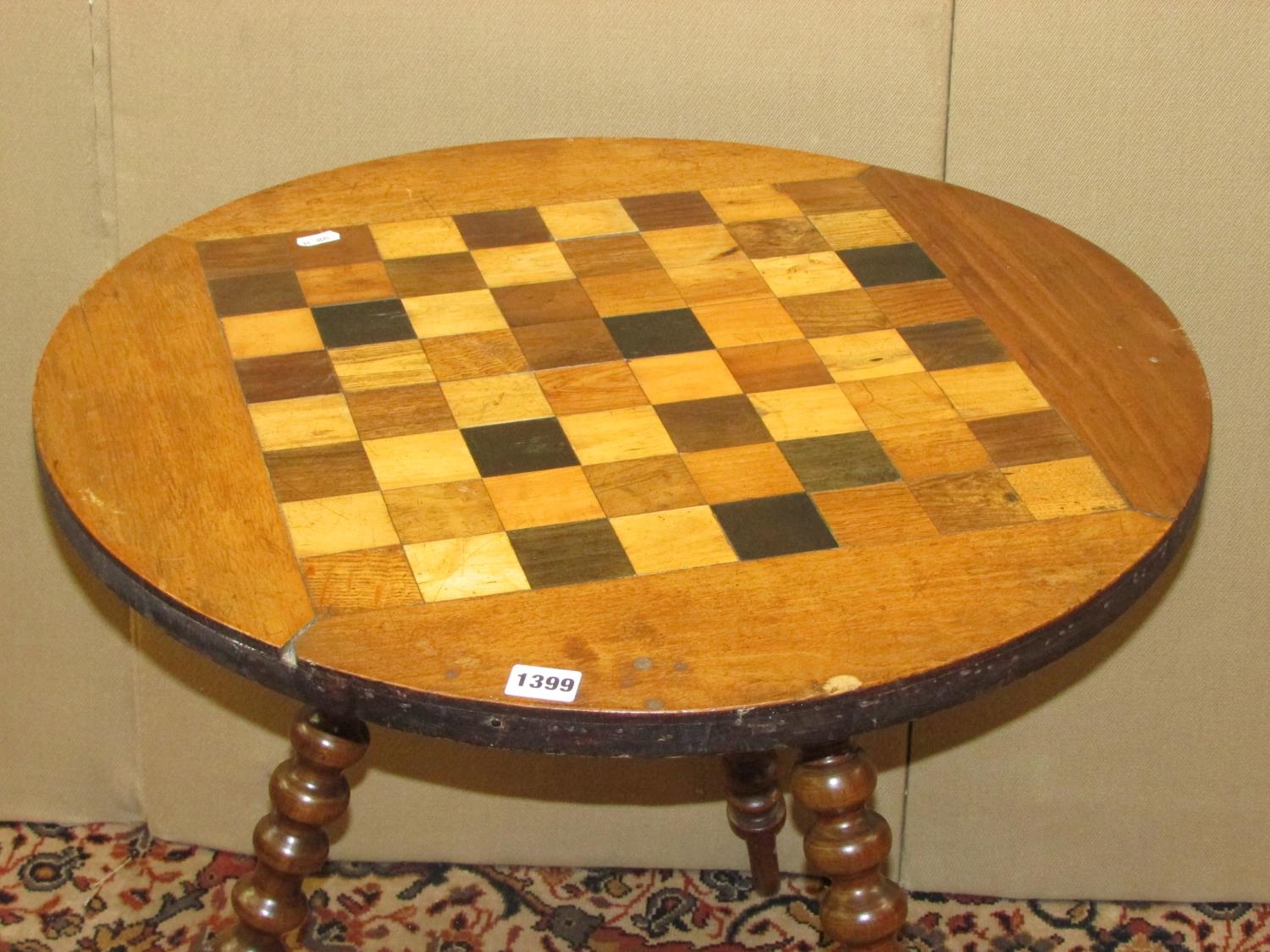 A 19th century chequerboard games table, in mixed woods, raised on three bobbin supports, 62cm - Image 2 of 3