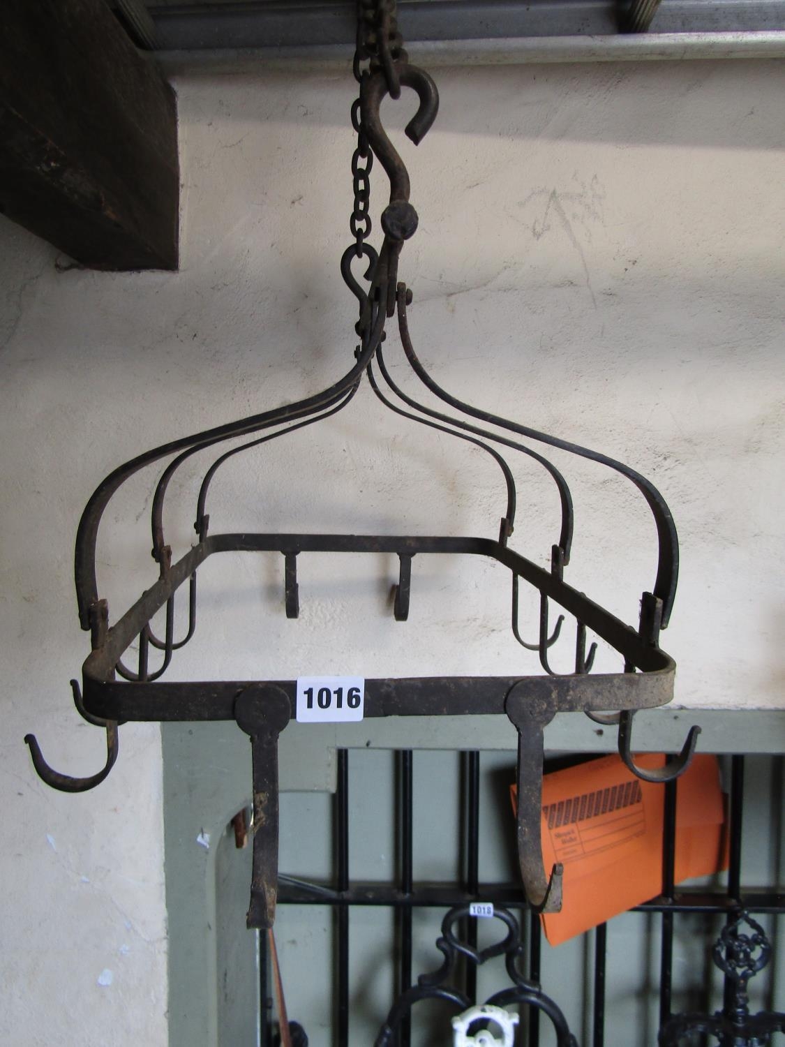 A vintage iron pot rack bearing twelve hooks with chain support 55cm long x 42cm wide approx