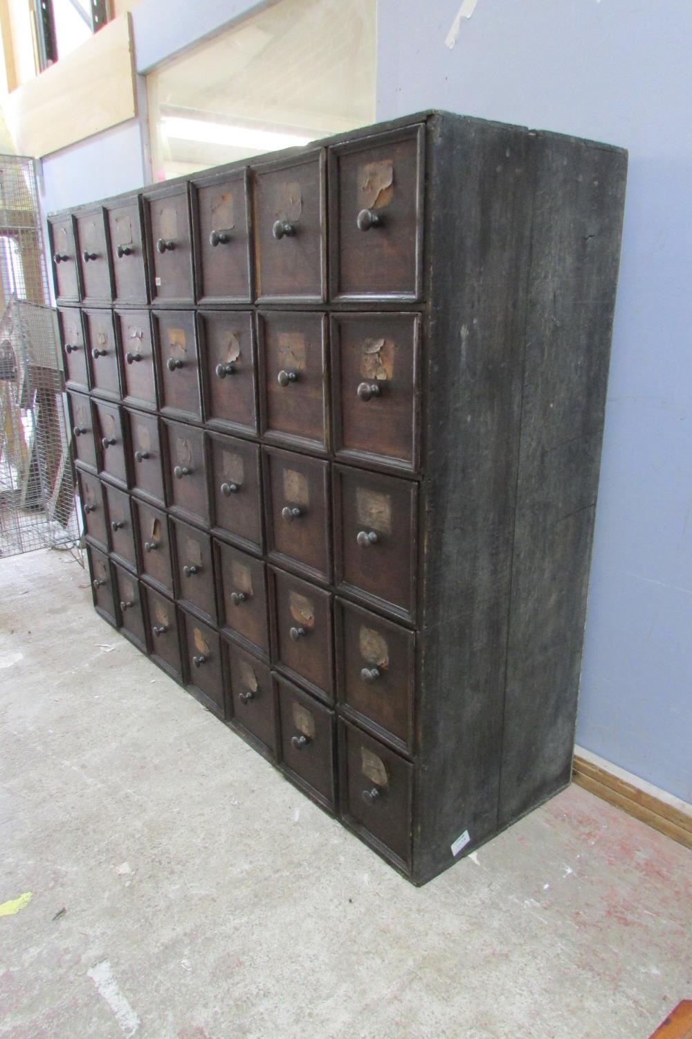 A very large 19th century oak run of 35 drawers, oak lined, each drawer 30 cm height x 27 cm wide - Image 4 of 5
