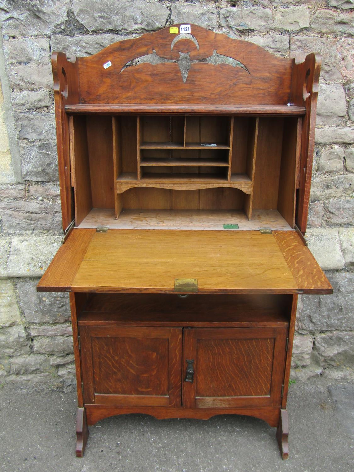 An early 20th century oak students bureau with strap hinges, the raised back with pierced detail - Image 2 of 5