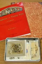 An album of book plates together with a tin of loose plates to be sorted and catalogued, including a