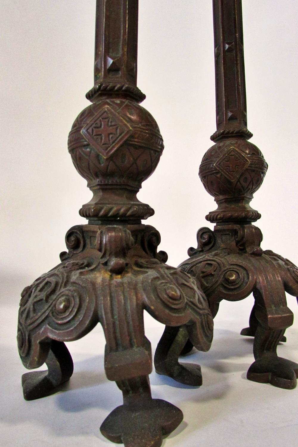 A pair of 19th century continental bronze ecclesiastical candlesticks, with crucifix and other - Image 4 of 5