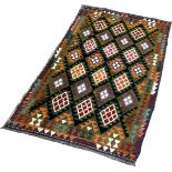 A Mimana Kilim with an overall field of multicoloured diamonds, 200 x 217cm approximately