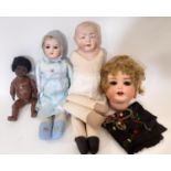 4 early 20th century bisque head dolls including a shoulder head 'Kaiser Baby' type character boy