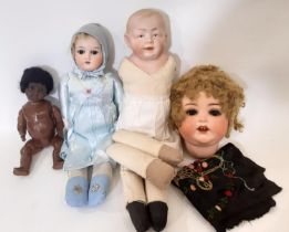 4 early 20th century bisque head dolls including a shoulder head 'Kaiser Baby' type character boy