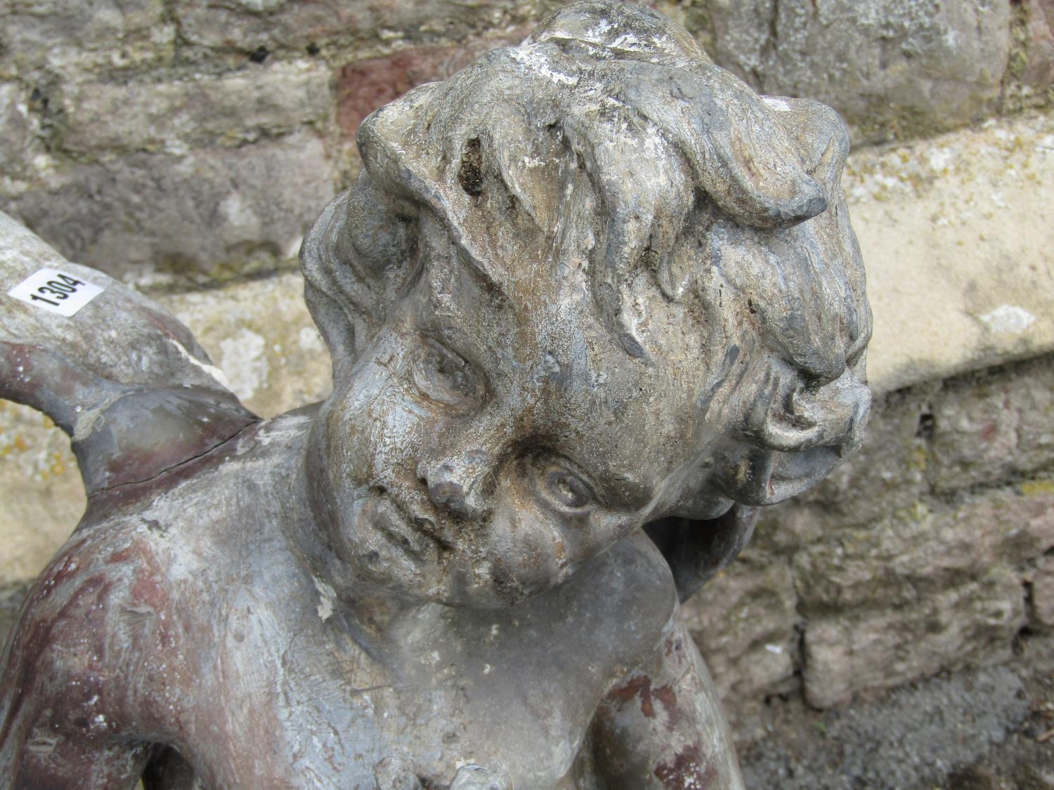 A 19th century lead water fountain in the form of a winged cherub clasping a fish, 80cm high - Image 3 of 5