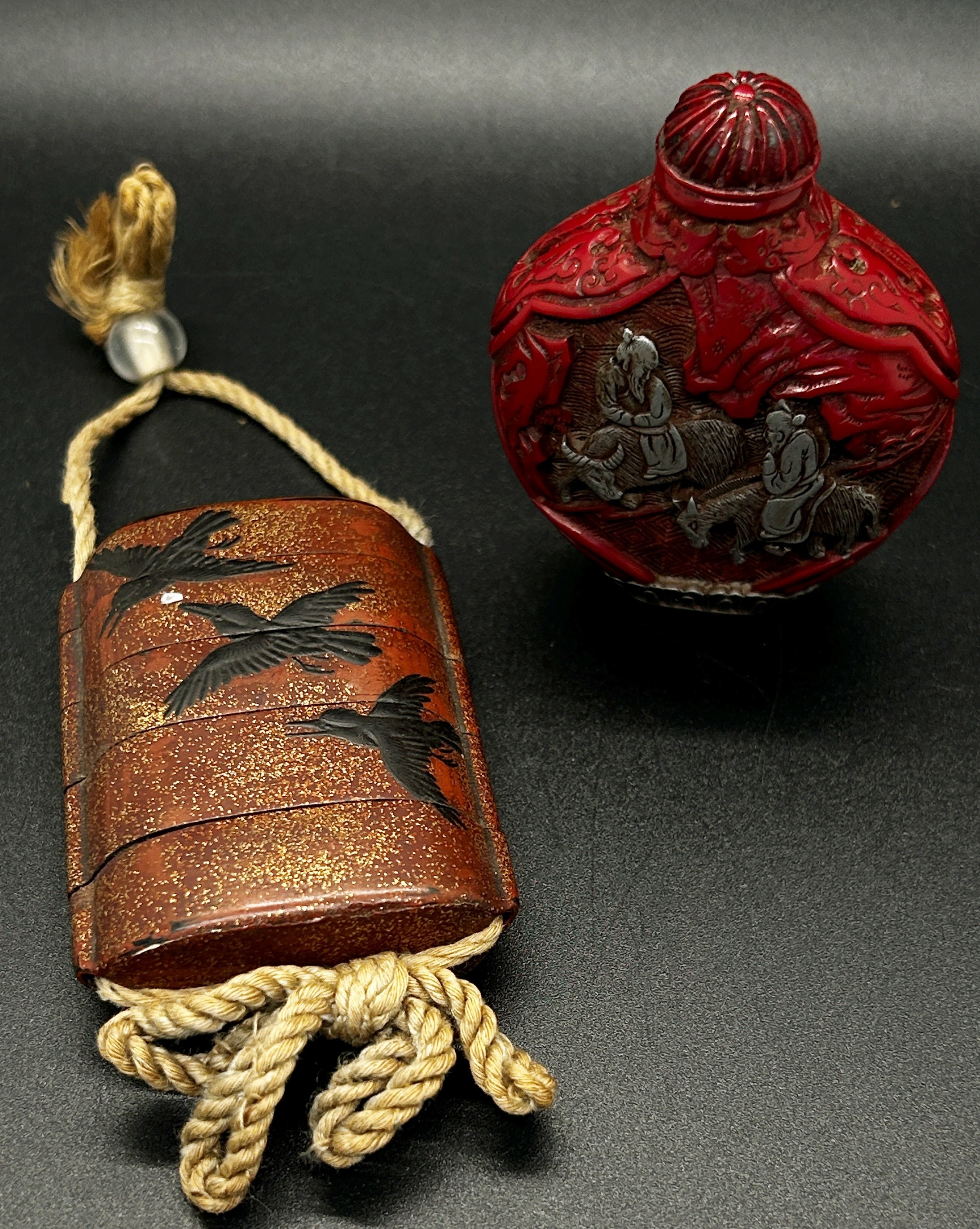 A four sectional Chinese lacquer inro of crows, two carved hard wood netsuke figures of animals