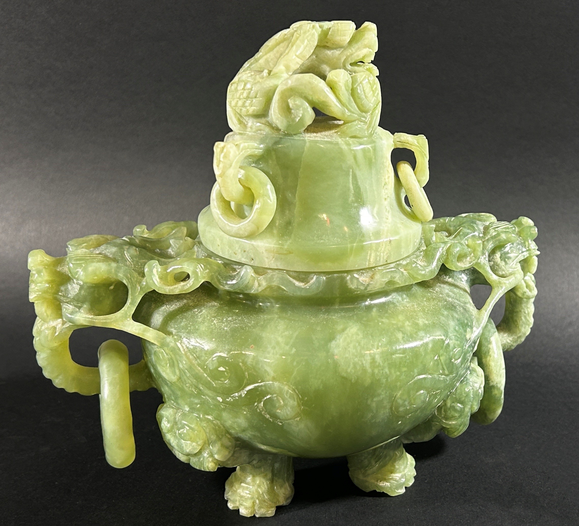 A Chinese celadon coloured jadeite lidded censor in the archaistic style, with triaged dragon mask