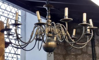 A large 12 branch chandelier in brass over 1m diameter