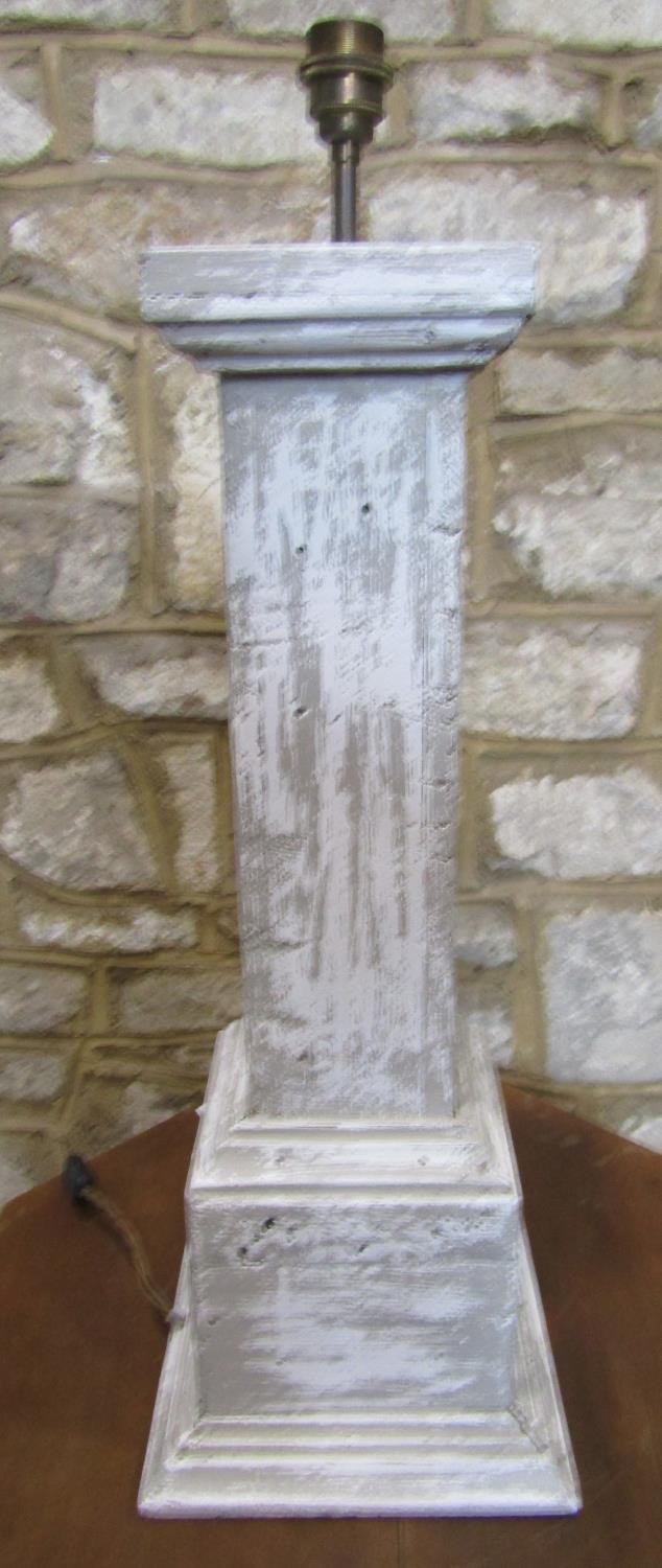 A panted pedestal lamp base of square cut form, 67cm high